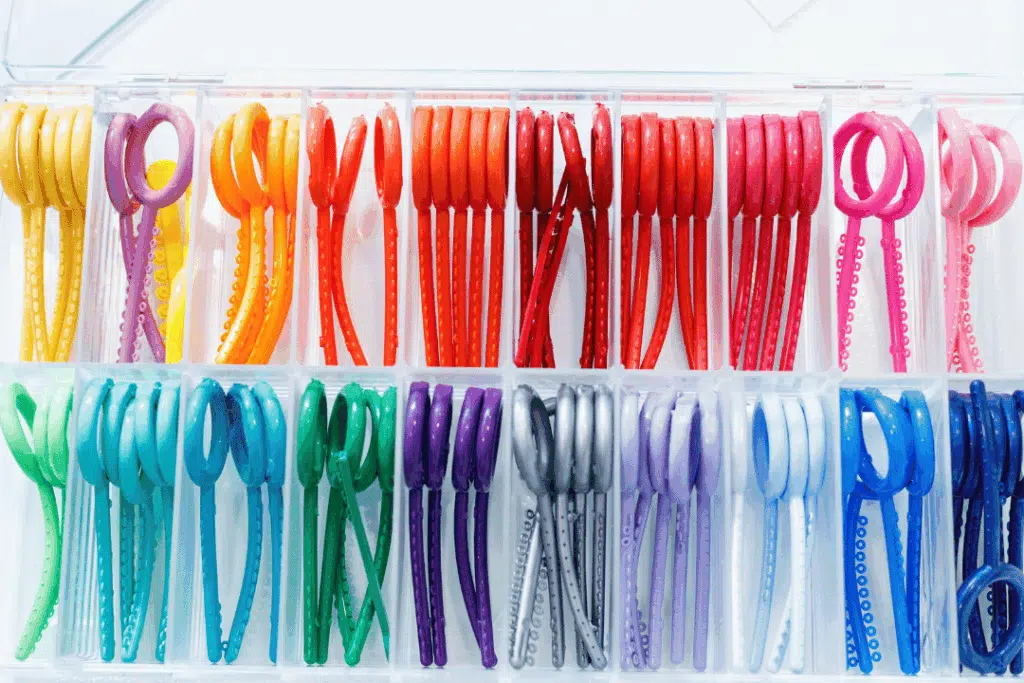 Teen choosing colorful braces bands