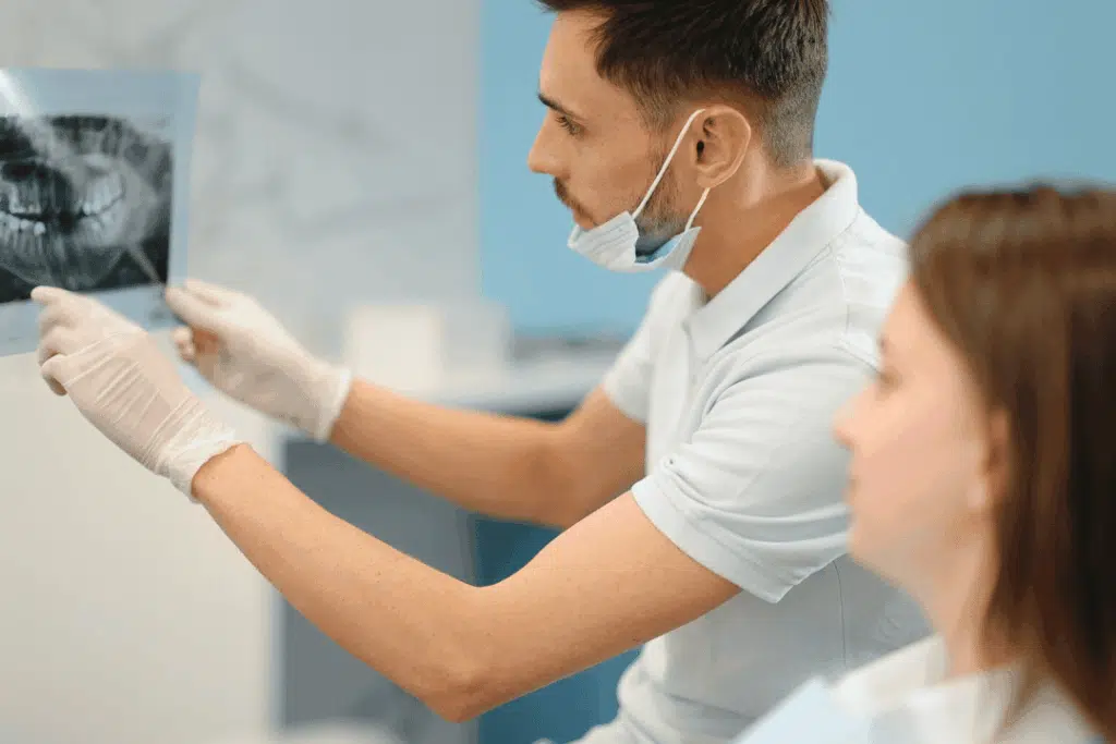 Orthodontist showing 3D jaw scan to patient