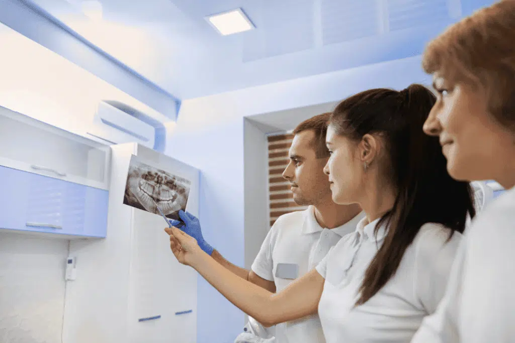orthodontist reviewing x-rays for braces