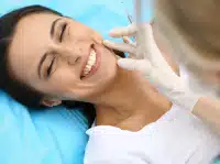 Patient smiling during dental treatment